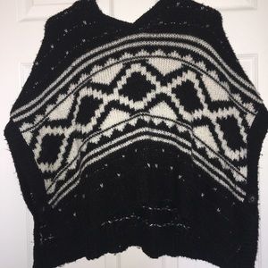 Black poncho with white designs